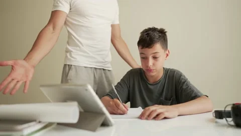 Father helping child do his homework at home. Homeschooling, distance learning Vidéo 196742269