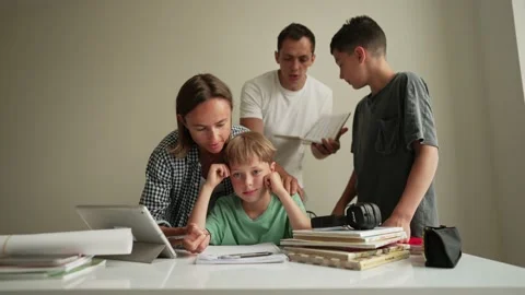 Father helping his son with schoolwork. Young little shoolboy solving 스톡 동영상 196828656