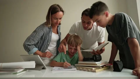Father helping his son with schoolwork. Young little shoolboy solving Stockbeeldmateriaal 196828679