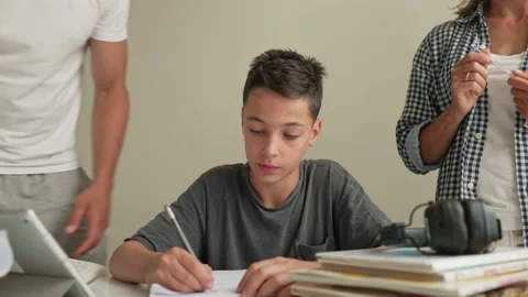 Father helping his son with schoolwork. Young little shoolboy solving Stock Footage 200953111