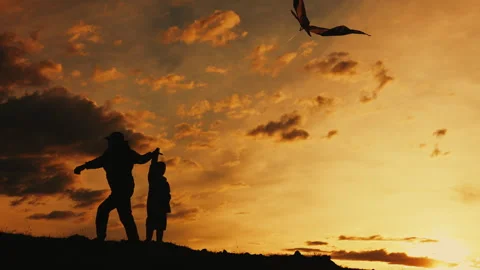 Father helps his son fly a kite. Family holiday. Stock Footage 280653693