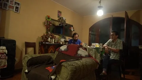 A father with his son watching the launch of a Space X rocket on living room tv 動画素材 146697762