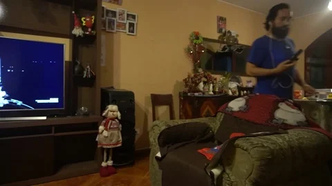 A father with his son watching the launch of a Space X rocket on living room tv Stock Footage 146697775