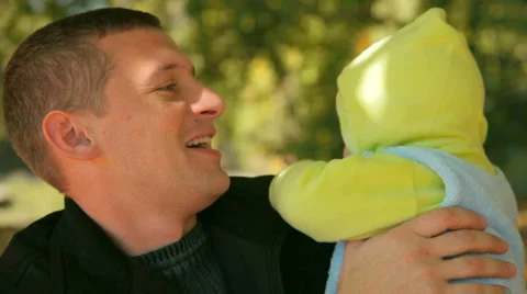 Father Holding Baby Stock Footage