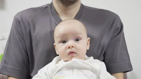 Father holding gently tiny newborn boy in his hands. Portrait of three month old Stock Footage 315033219