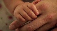 Father Holding Hands With His Baby Daughter. Stock Footage