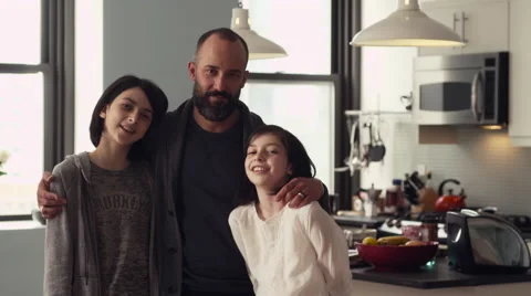 Father interacting with daughters in kitchen Stock Footage 63860783