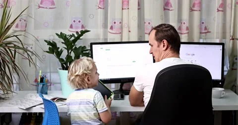 Father with kid trying to work from home during quarantine. Stock Footage 168940691