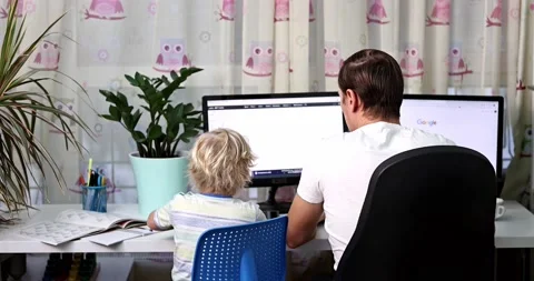 Father with kid trying to work from home during quarantine. Stock Footage 168940733