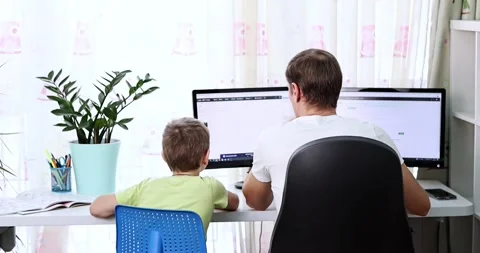 Father with kid trying to work from home during quarantine. Stock Footage 169407524