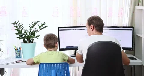 Father with kid trying to work from home during quarantine. Stock Footage 170140803