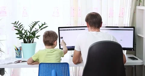 Father with kid trying to work from home during quarantine. Stock Footage 170140835