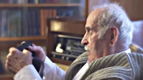 Father Old Man Puts vr Glasses on Excited Grandfather is Watching Amazing Video Stock Footage 72229891