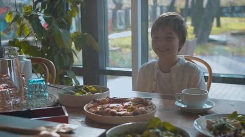 Father opens a present, boy watches and smiles Stock Footage 120735749