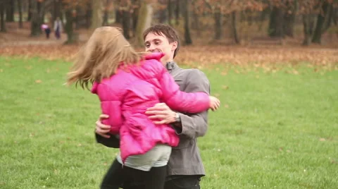 Father playing with daughter in park Stock Footage 59554143