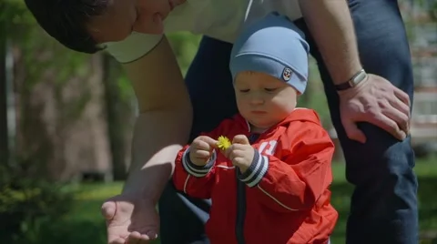 Father playing in the grass with his small son Video stock 63368023