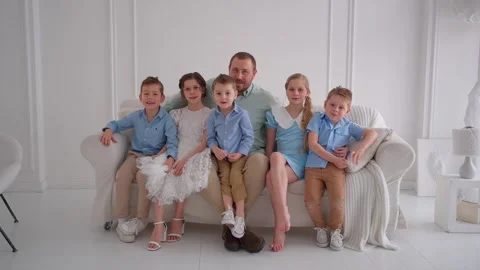 Father posing with five smiling children. Family unity concept. Stock Footage 307178106