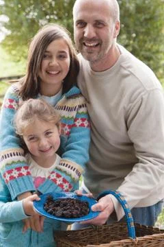 Father posing with his daughters Stock Photos