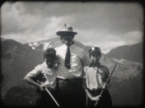 Father Posing with Two Sons and Guns - Vintage - 1930s Stock Footage 77522142