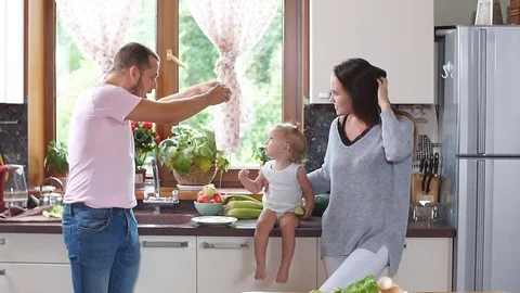 Father preparing Breakfast in the kitchen. Slow motion Stock Footage 80278698