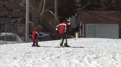 Father Pulling Child on Skis Stock Footage 26067137