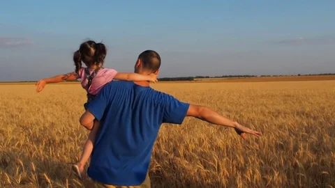 Father raised a child in his arms. Stock Footage