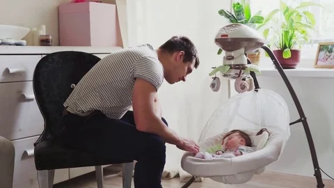 Father rocking the cradle Video stock 81877638