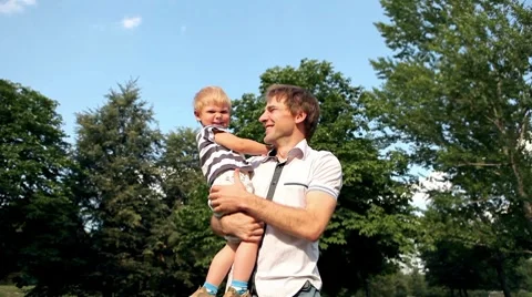 Father rotate son on the head Stock Footage
