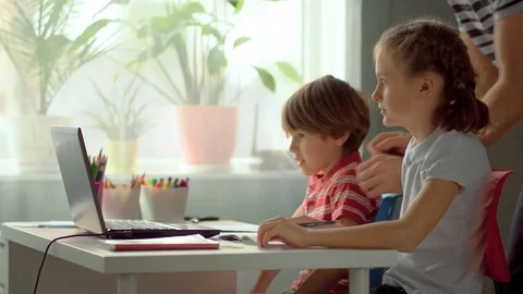 The father sets up access to distance learning for children. Stay home concept. Stock Footage 128957067