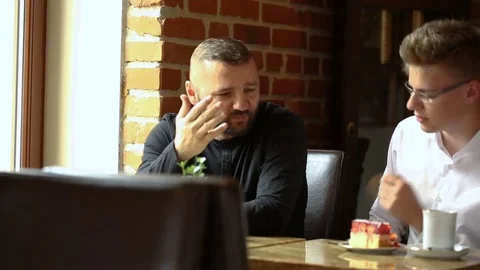 Father shouting on his son in the cafe Stock Footage 80424774