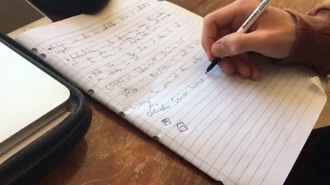 Father shows difference between handwriting in boys and girls 動画素材 109250974