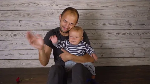 Father with a small baby Stock Footage 80280421