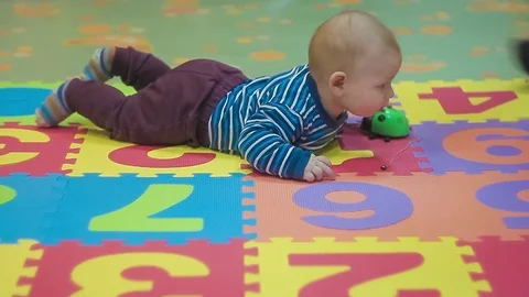 Father With Small Son Playing on Floor in Room Stock Footage 72320863