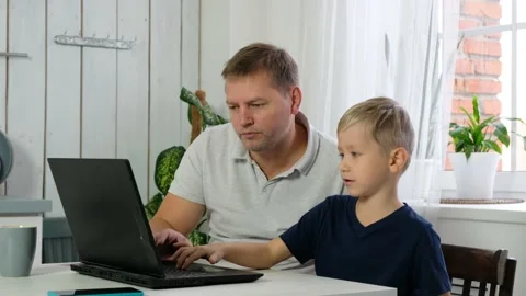 Father with son boy learning online on pc laptop, distance education at home Stock Footage 142627035