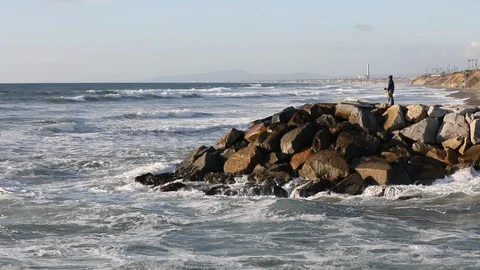 Father Son Ocean waves surf rolling into shore slow HD Stock Footage 99764267