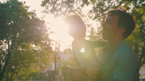 Father with son play in the park in spring. Slow motion Stock Footage 245270513