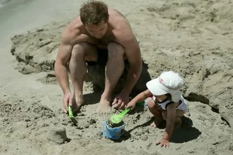 Father with son playing in sand on the beach Vídeos de archivo 11166962