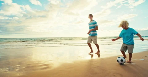 Father Son Playing Soccer on Beach Stock Footage 66060068