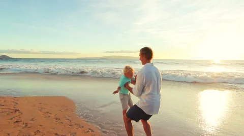Father Son Playing Together at the Beach Sunset. Stock Footage 56531508