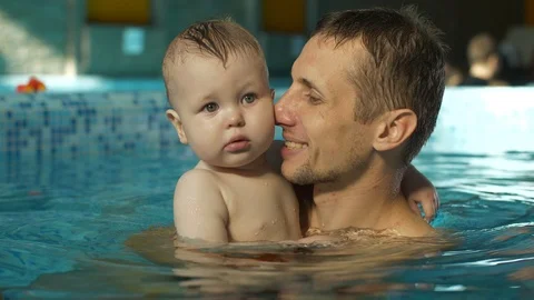 Father with son in the pool Stock Footage 101712104