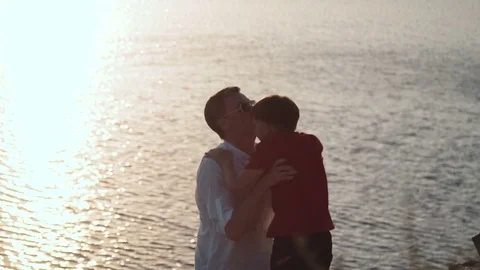 Father with son on shore of lake Stock Footage