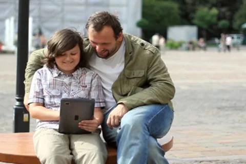 Father with son with tablet computer in the city NTSC Stock Footage 8524251