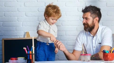Father son together, developing games for child, drawing and education Stock Photos