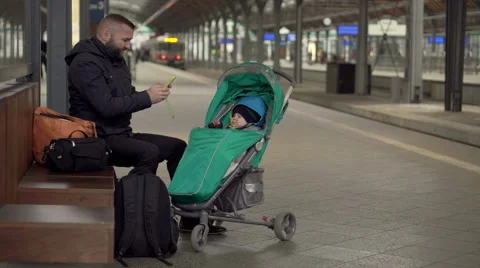 Father with son using mobile on station  Stock Footage 60662718