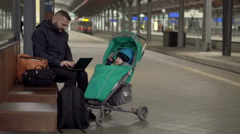 Father with son using mobile on station  Stock Footage 60662772