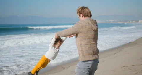 Father spending time with his kid at beach 스톡 동영상 127456269