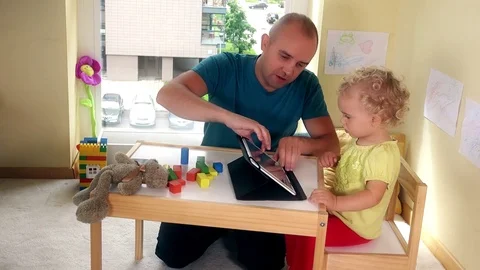 Father take tablet computer from his child girl and walk away Stock Footage 72265141