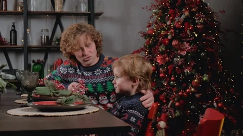 Father Talking To His Son Sitting At The Table At Christmas Stock Footage 241108234
