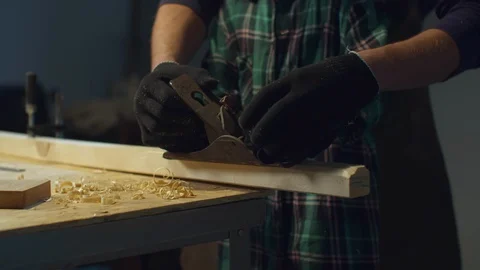 Father teaches his son to use a planer. Paternity Stock Footage 128179401