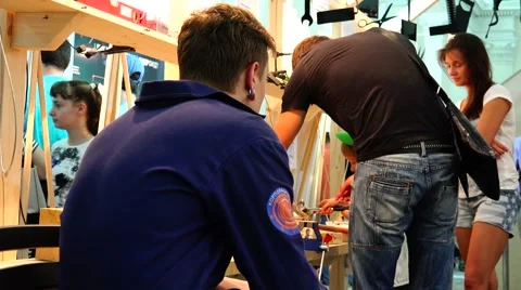 The father teaches his son to work with the tools. New technologies. Stock Footage 52361367